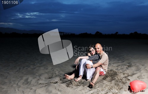 Image of happy young couple have fun on beach