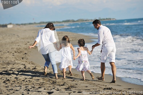 Image of happy young  family have fun on beach