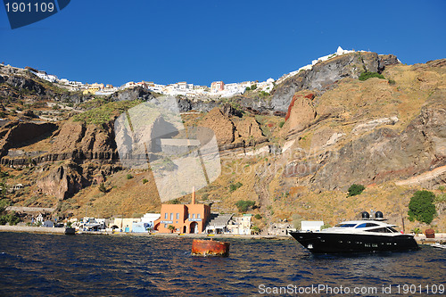 Image of santorini island coast with luxury yacht