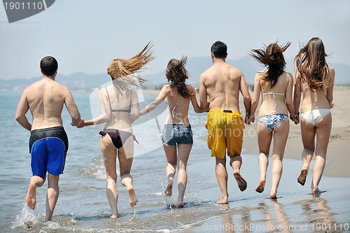 Image of happy young  people group have fun on beach
