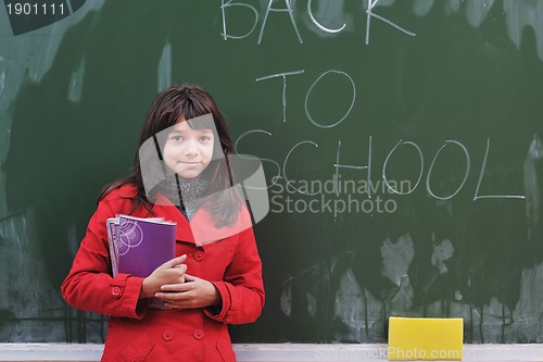 Image of happy school girl on math classes