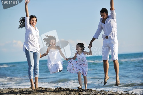 Image of happy young  family have fun on beach
