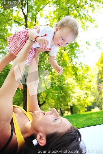 Image of woman and baby have playing at park