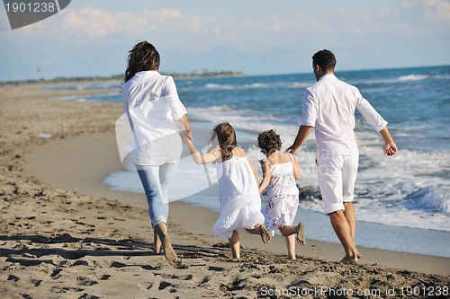 Image of happy young  family have fun on beach