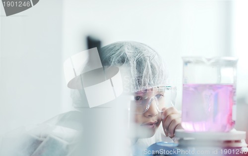 Image of little child scientist in lab