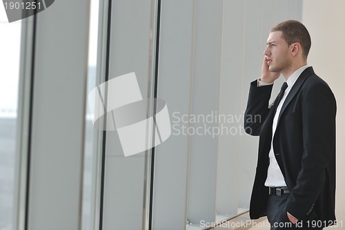 Image of young business man talk by cellphone