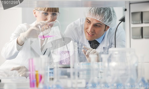 Image of science people in bright lab