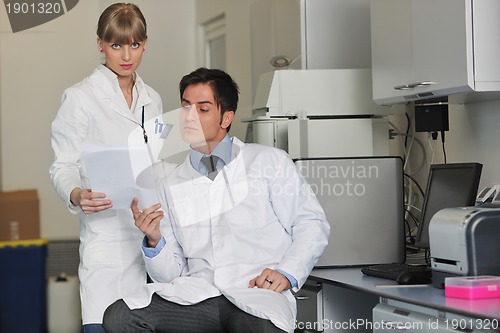 Image of science people in bright lab