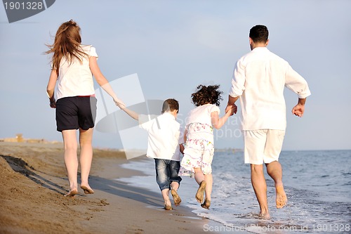Image of happy young family have fun on beach