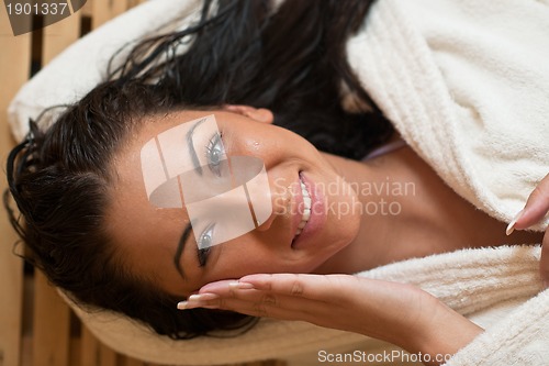 Image of Young woman take a steam bath