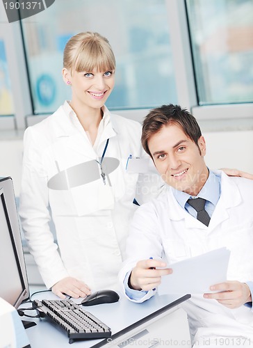 Image of science people in bright lab