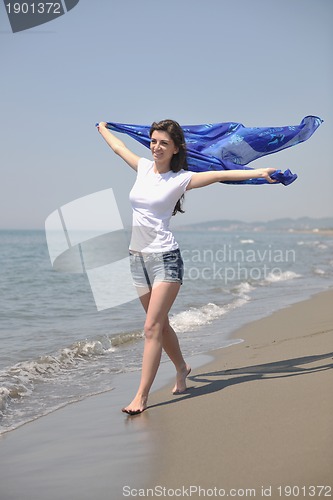 Image of young woman enjoy on beach