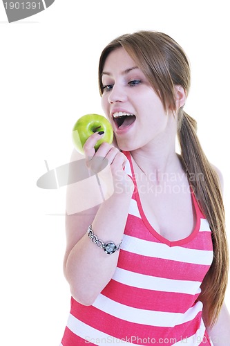 Image of happy  young  woman eat green apple isolated  on white