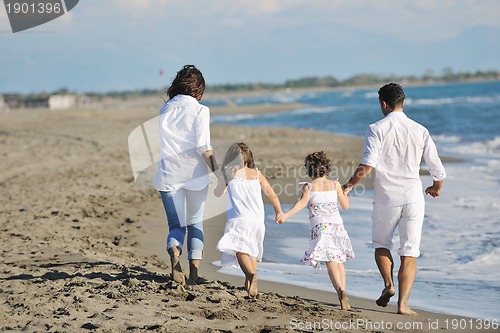 Image of happy young  family have fun on beach