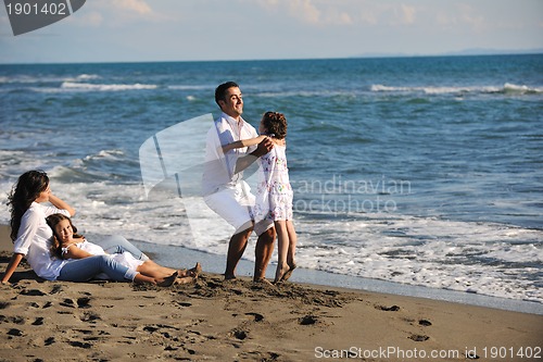 Image of happy young  family have fun on beach