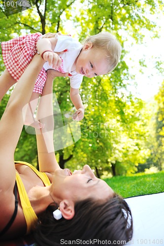 Image of woman and baby have playing at park