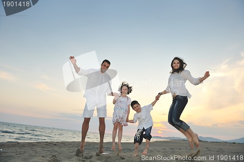 Image of happy young family have fun on beach