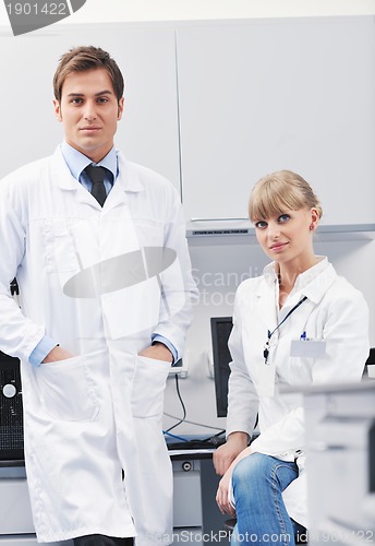 Image of science people in bright lab