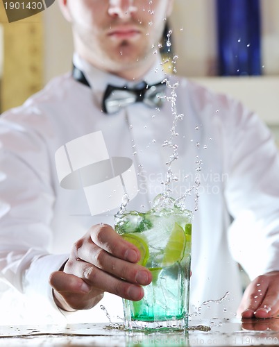 Image of pro barman prepare coctail drink on party