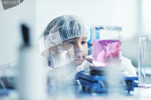 Image of little child scientist in lab