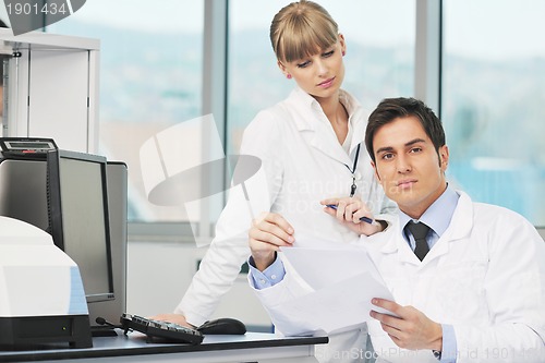 Image of science people in bright lab