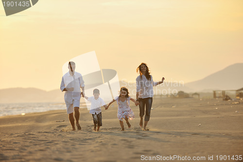 Image of happy young family have fun on beach