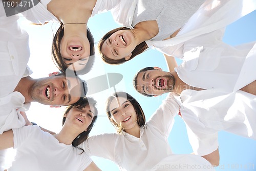Image of Group of happy young people in have fun at beach