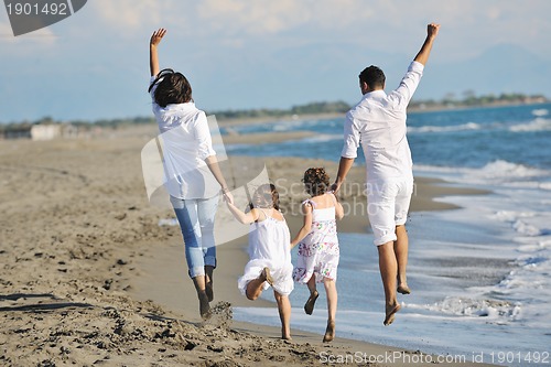 Image of happy young  family have fun on beach