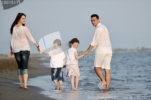 Image of happy young family have fun on beach