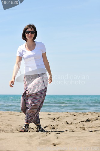 Image of young woman relax  on beach