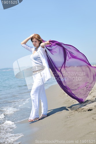 Image of young woman relax  on beach