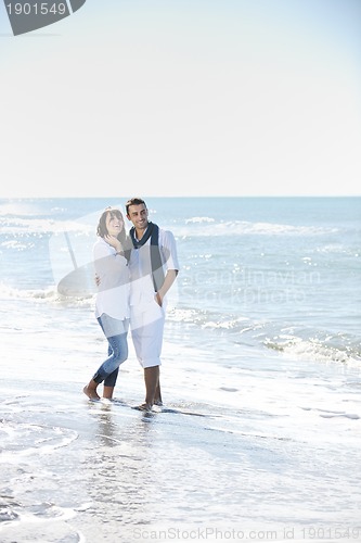 Image of happy young couple have fun at beautiful beach