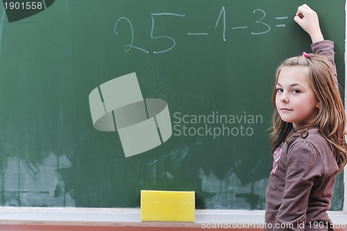 Image of happy school girl on math classes