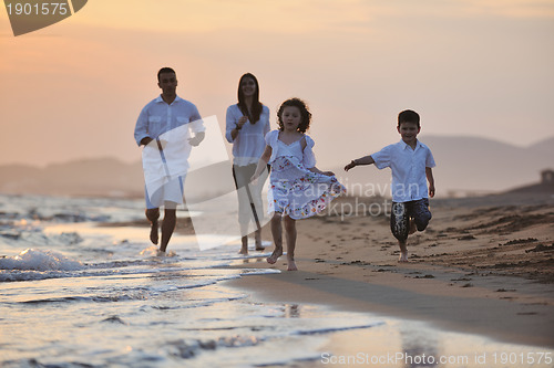 Image of happy young family have fun on beach