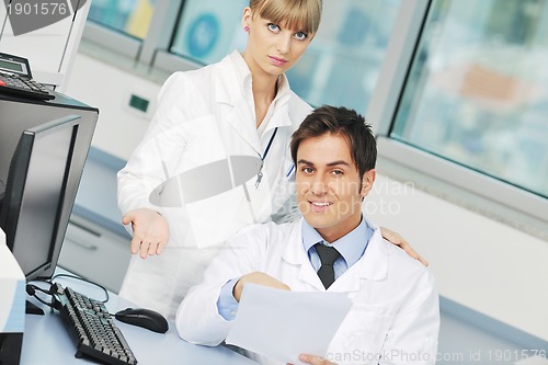 Image of science people in bright lab