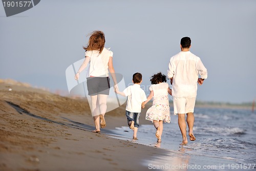 Image of happy young family have fun on beach