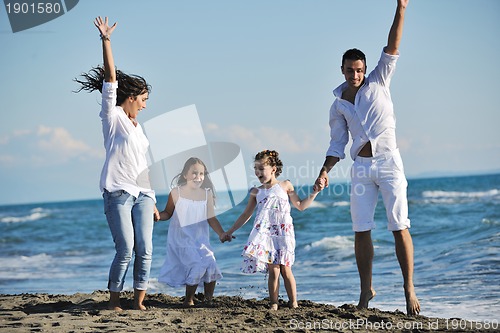 Image of happy young  family have fun on beach