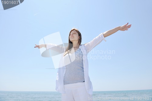 Image of young woman relax  on beach