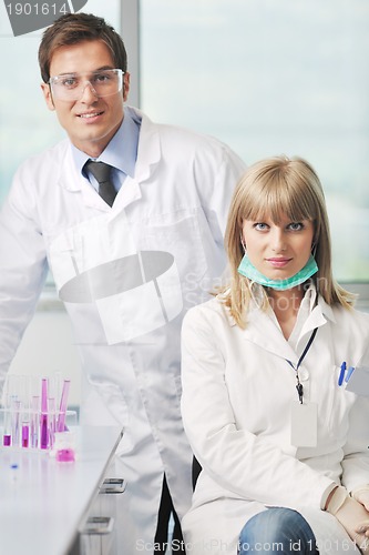 Image of science people in bright lab