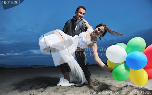 Image of romantic beach wedding at sunset