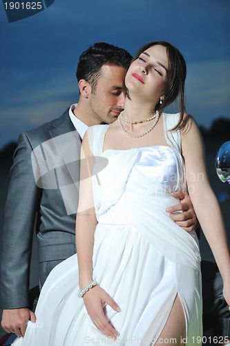 Image of romantic beach wedding at sunset