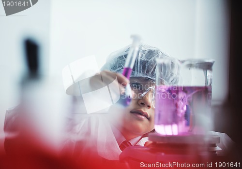 Image of little child scientist in lab