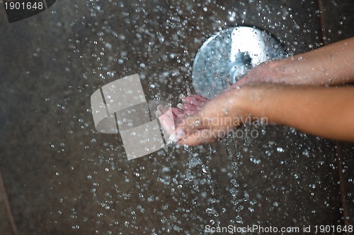Image of sexy young woman enjoing bath under water shower