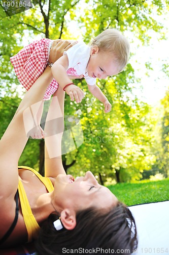 Image of woman and baby have playing at park