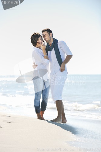 Image of happy young couple have fun at beautiful beach