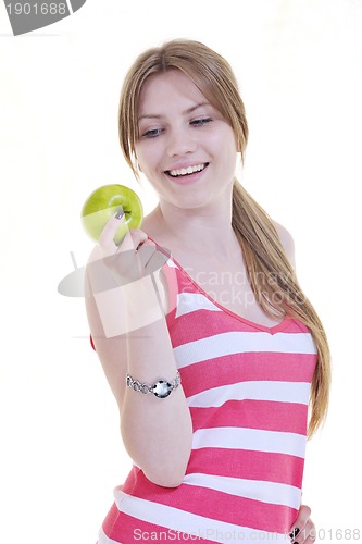 Image of happy  young  woman eat green apple isolated  on white