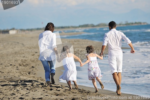 Image of happy young  family have fun on beach