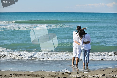 Image of happy young couple have fun at beautiful beach