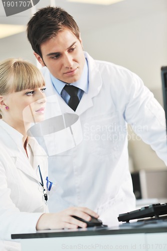 Image of science people in bright lab