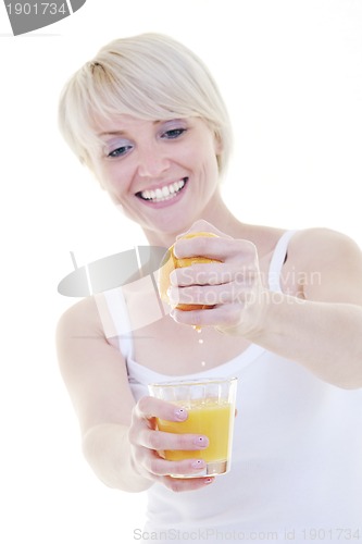 Image of Young woman squeeze orange juice